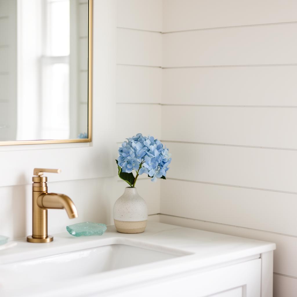 Modern coastal farmhouse bathroom detail with hydrangea